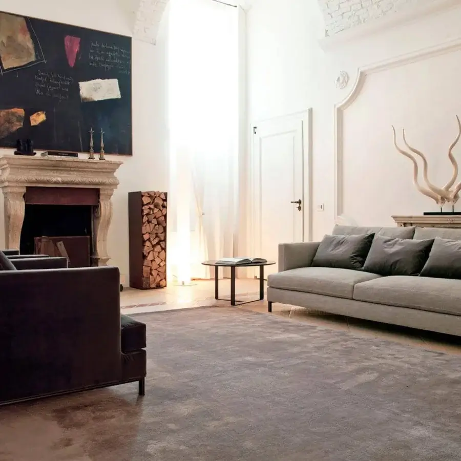Elegant Verzelloni Hampton sofa with heathered gray textile upholstery and slender dark metal legs