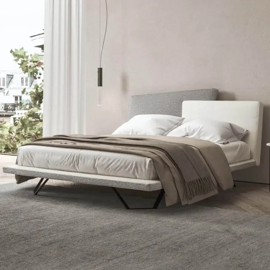 Elegant Presotto Meeting bed with light-grey and neutral upholstery, dark metal base, plus subtly textured padded design