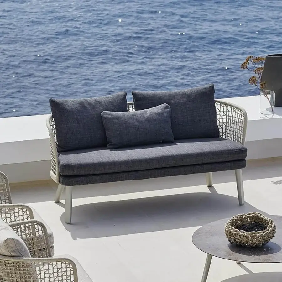 Distinguished Varaschin Emma sofa with light-colored aluminum frame hand-woven in a basket effect and dark gray textured fabric cushions