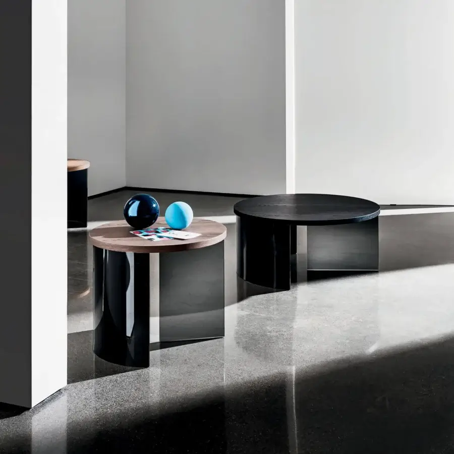 Distinguished Sovet Italia Regolo coffee table with dual circular tiers in warm wood and deep-black lacquered laminated glass with a matte finish