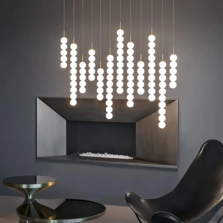 Innovative Terzani Abacus Multi Light suspension lamp with brass and satin white glass spherical diffusers connected by metal cables