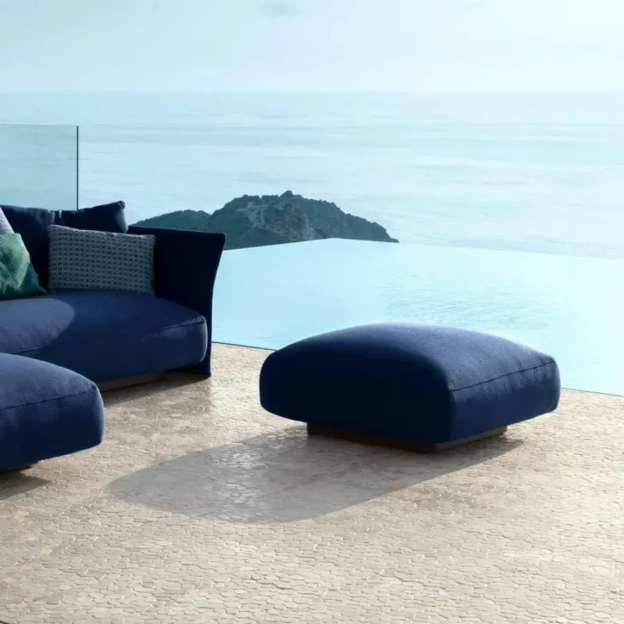 Distinguished Talenti Cliff ottoman with deep blue weather-resistant textile and graphite powder-coated aluminum structure