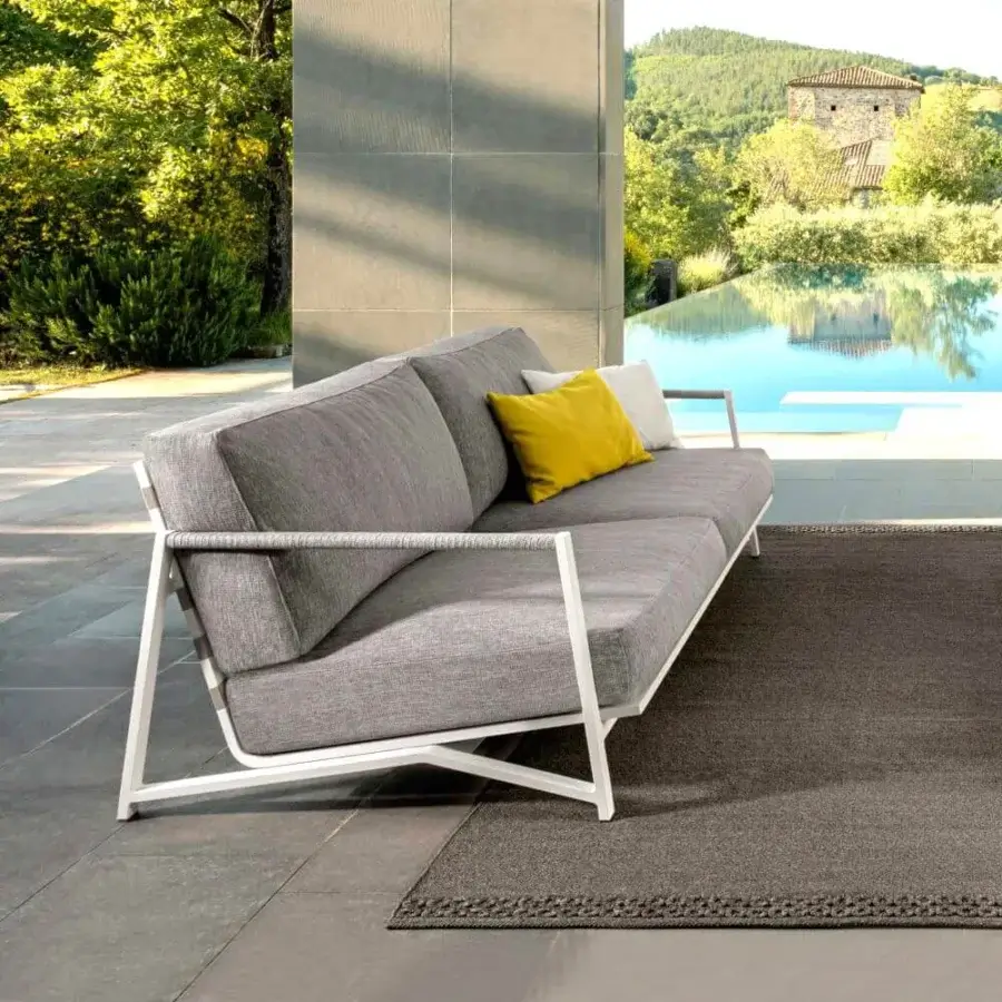 Distinguished Talenti Cottage sofa with aluminum frame, textured gray fabric cushions, and nautical rope detailing