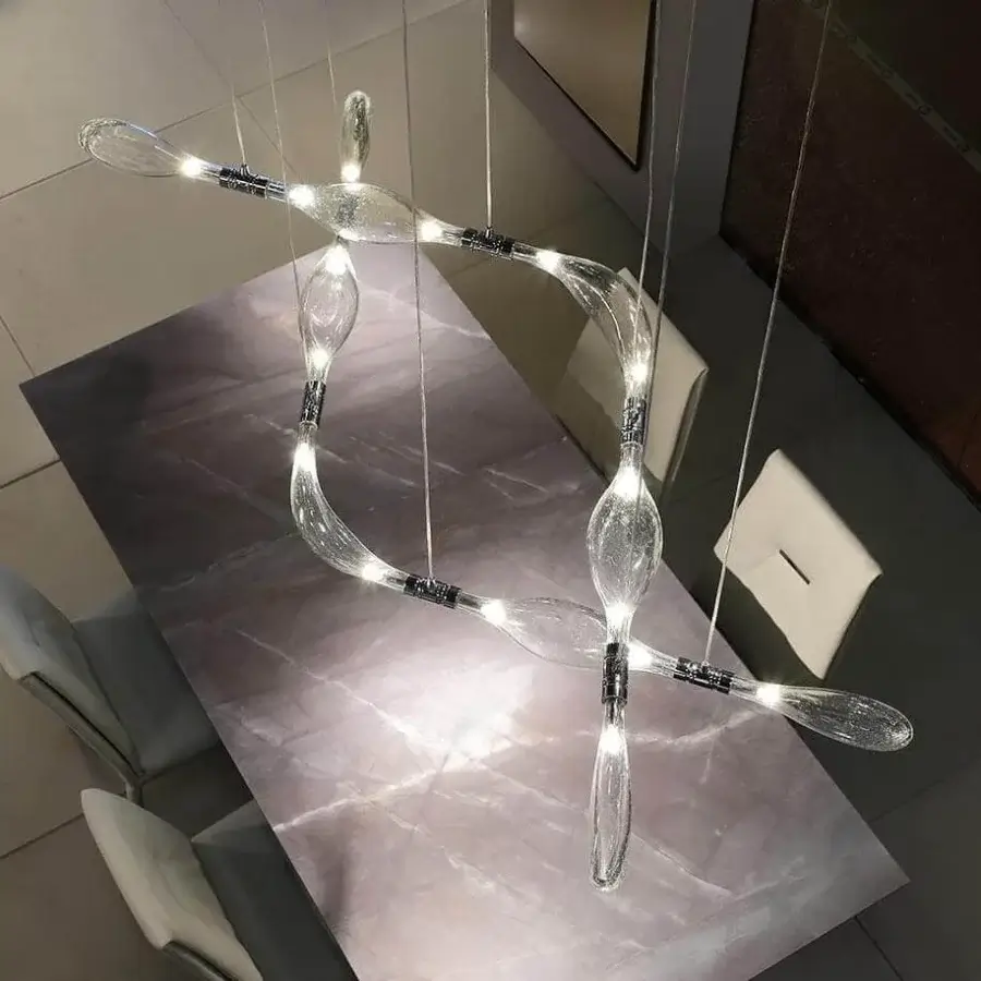 Captivating Reflex Firefly suspension lamp crafted in transparent blown glass with a polished chrome metal framework