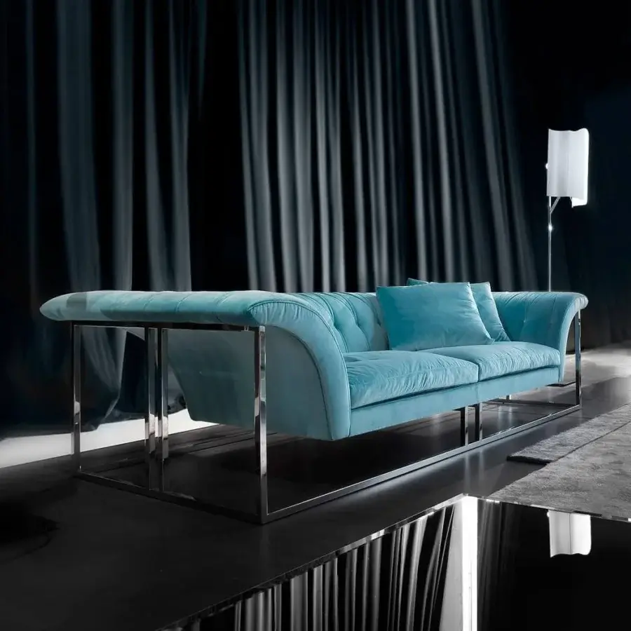 Distinctive Erba Rockouture sofa with curved forms upholstered in textured muted teal fabric and polished stainless steel base
