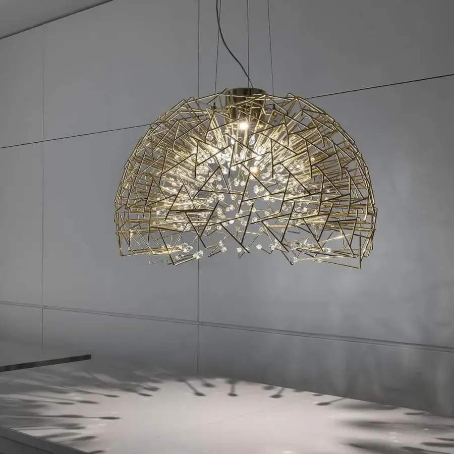 Exclusive Terzani Core suspension lamp crafted in brass and crystal with a satin finish creating dynamic light interplay