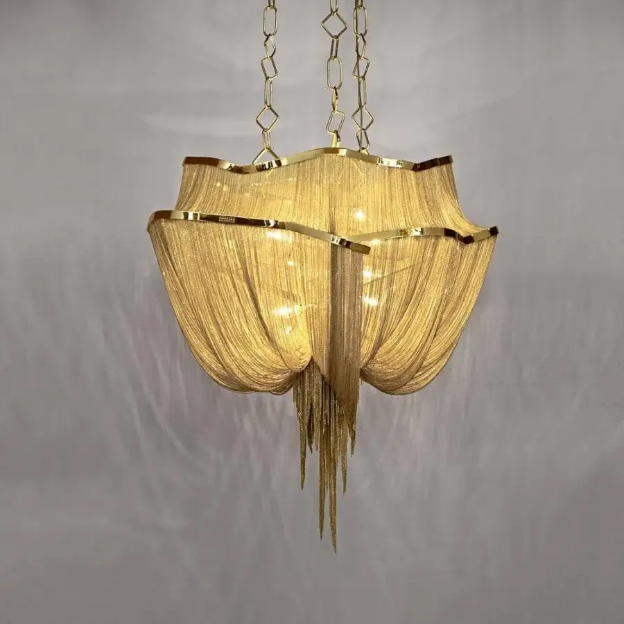 Exclusive Terzani Atlantis suspension lamp crafted in warm gold tone with hundreds of illuminated draped brass chains and reflective finish