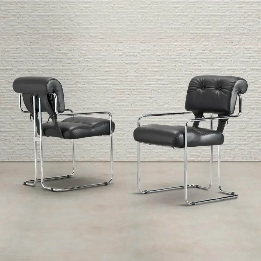 Distinguished 4 Mariani Tucroma armchair in smooth matte black leather with polished steel frame and button-tufted backrest