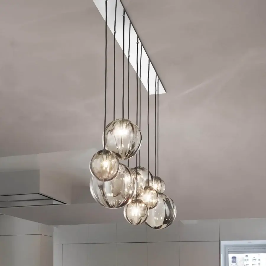 Elegant Vistosi Puppet suspension lamp crafted with hand-blown glass shades and glossy chrome metal components in subtle gray-brown tones