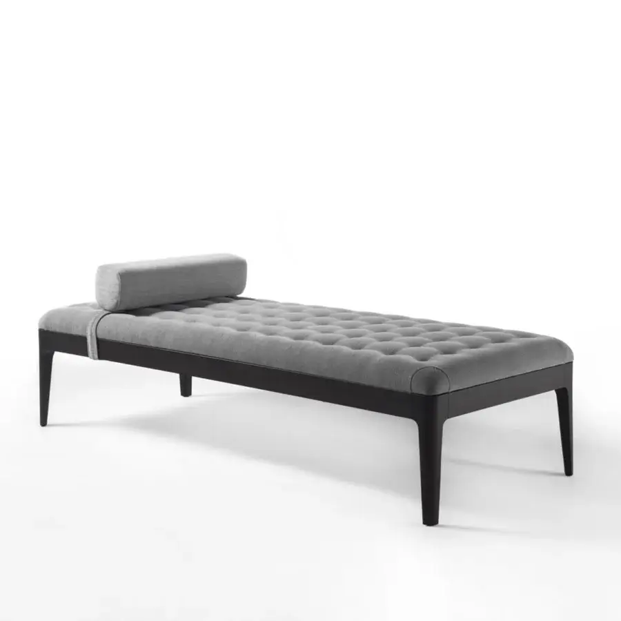 Sophisticated Porada Webby chaise lounge with a solid Canaletto walnut frame and luxuriously tufted gray fabric cover including a cylindrical bolster pillow