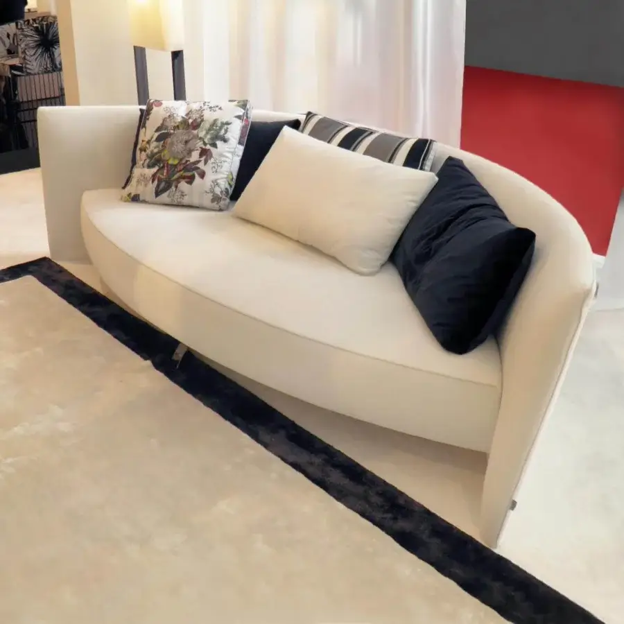 Exceptional Erba Ibiza sofa with curved silhouette upholstered in smooth off-white textile and black chrome steel feet