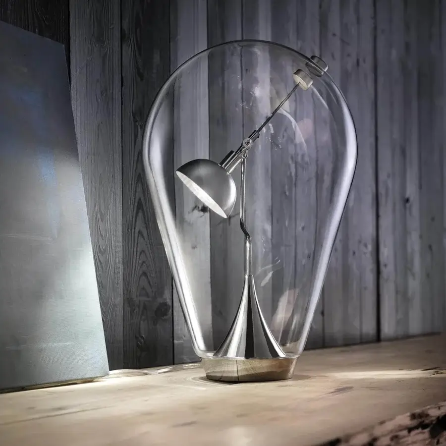 Distinguished Lodes Blow table lamp with oversized blown-glass enclosure and natural light-brown wooden base crafted with polished silver-tone metal