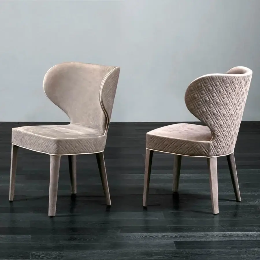 Superior Rugiano Aida chair crafted with wood and plush textured fabric in a warm beige tone with satin-finish legs