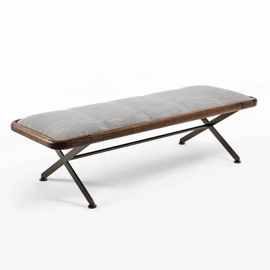 Padded light gray surface with dark brown wood-like frame rests on angled dark metal legs forming an X-shaped base