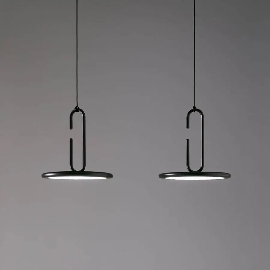 Elegant Penta Clip suspension lamp with refined metal structure and matte black finish for overhead illumination