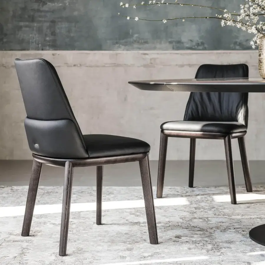 Distinguished Cattelan Italia Belinda chair crafted with natural ash wood and smooth matte dark leather with a satin finish