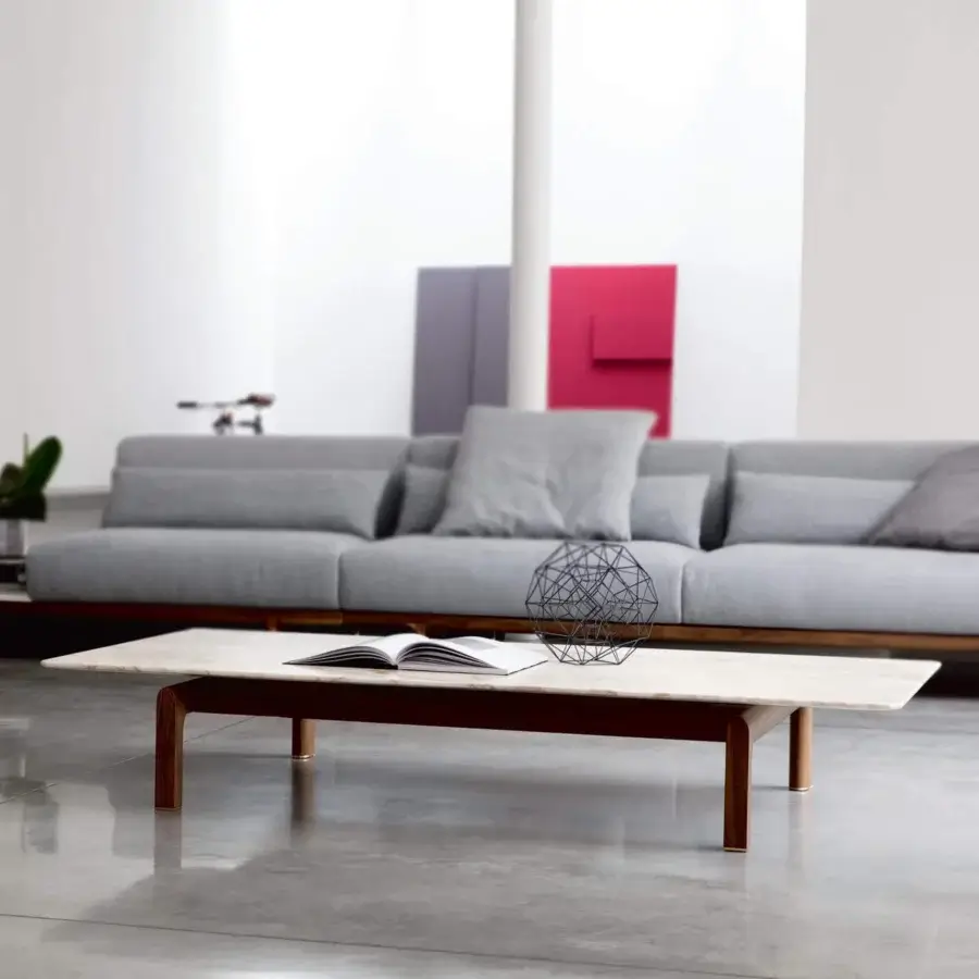 Distinguished Porada Quay coffee table with a Marble top and recessed solid Canaletto walnut wood frame in satin finish
