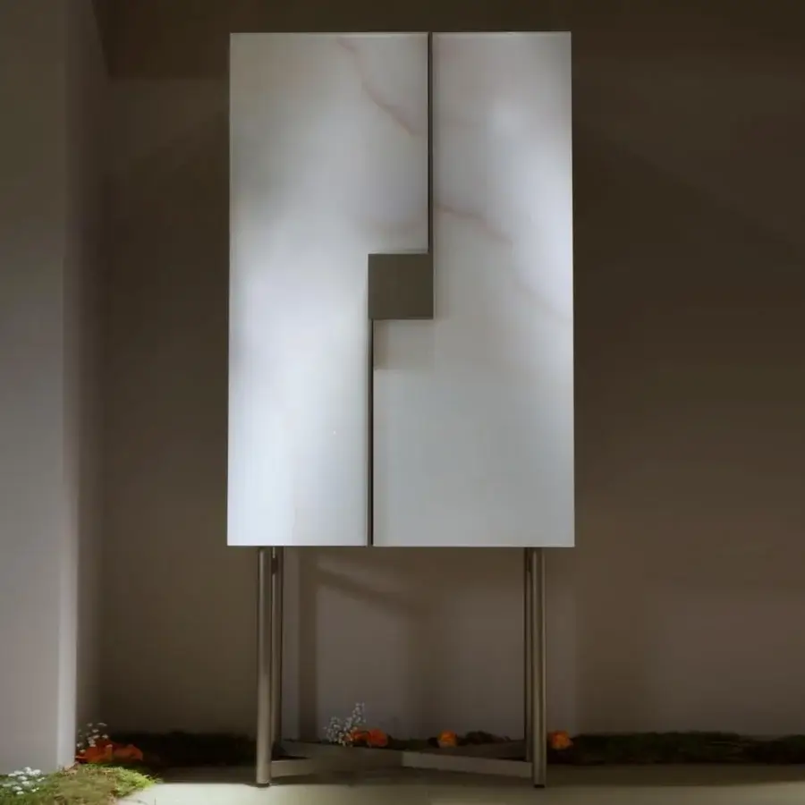 Exclusive Reflex Musa cupboard with pale off-white and light grey veined Marble glass, satin finish and bronze-finished metal base