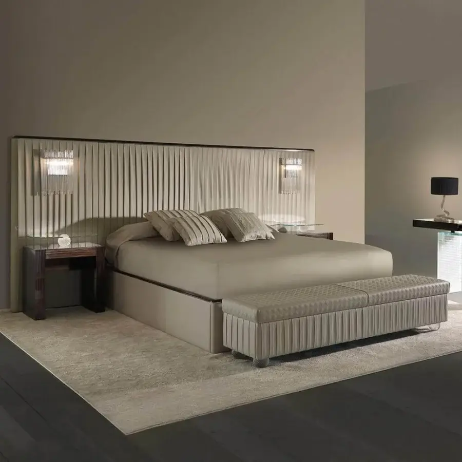 Distinguished Reflex Plissé XL bed with upholstered headboard and frame in muted beige textile with shiny metal and ebony wood accents