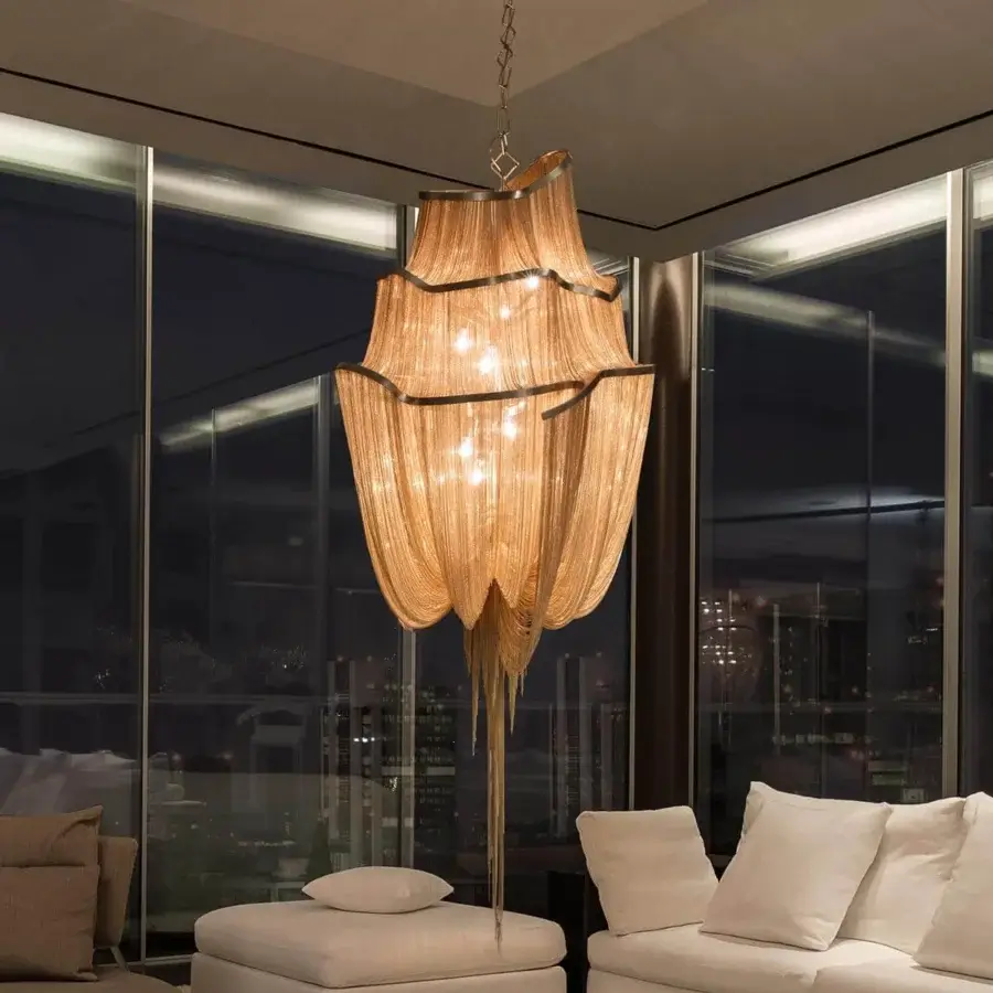 Distinguished Terzani Atlantis suspension lamp crafted in brass chains with a warm golden-brown tone and cascading form