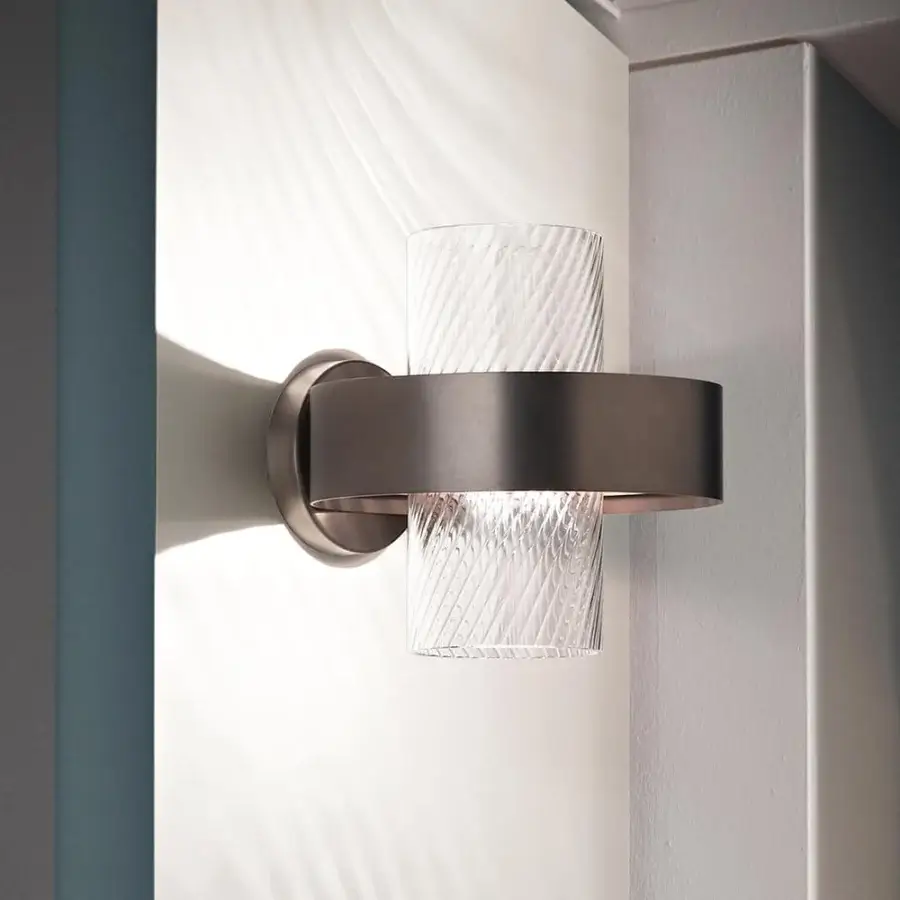 Elegant Vistosi Armonia wall lamp with a metal ring frame and vertically ribbed translucent glass diffuser crafted in dark bronze or charcoal gray with a satin finish