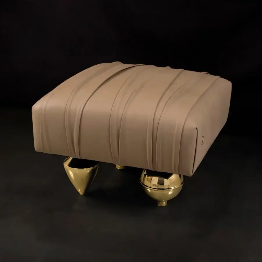 Distinguished Il Pezzo Mancante Il Pezzo 1 ottoman upholstered in warm beige velvet with polished sand brass casting