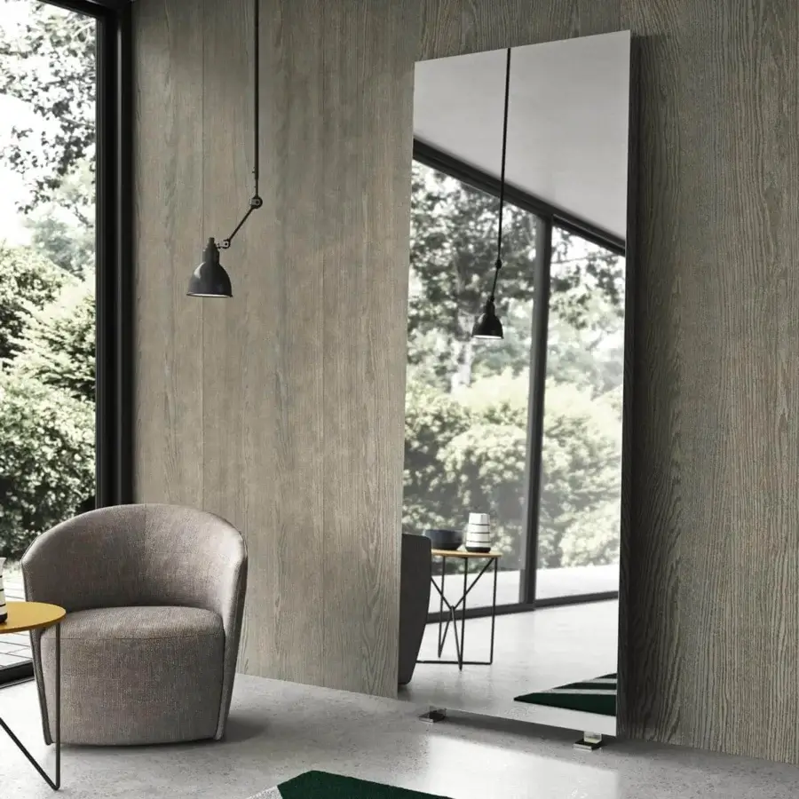 Refined Presotto Tuttospecchio mirror crafted with glass and matte gray-brown wood, exhibiting a contemporary aesthetic with chromed metal feet