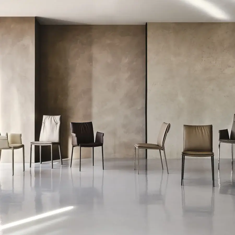 Distinguished Cattelan Italia Isabel chair with black upholstery and slender exposed steel legs