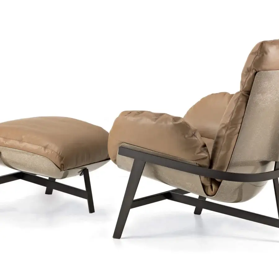 Elegant Arketipo Jupiter lounge chair with a tan leather shell and matte dark metal arch structure
