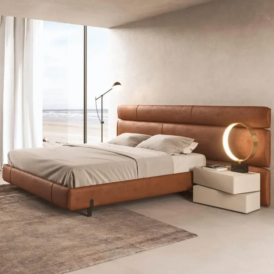 Distinguished Presotto Niobe bed with warm brown leather upholstery and a dark-toned metal base exhibiting a matte finish