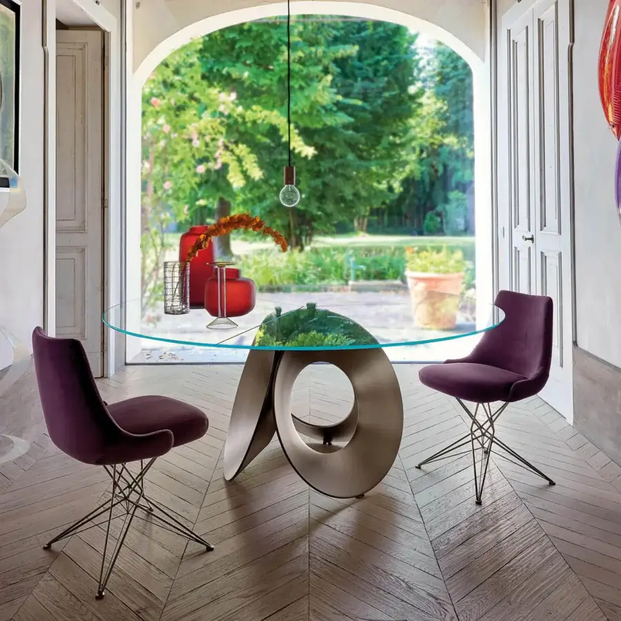 Exceptional Arketipo Oracle table with a round glass top and looping metal base crafted in a matte, bronze-toned finish