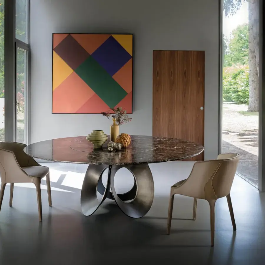 Exclusive Arketipo Oracle table with a brown marbled top and unique bronzed metal base crafted in overlapping circles