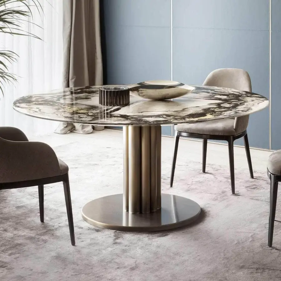 Distinguished Rugiano Forest round table with marble-like stone top and warm-toned metal pedestal base in satin finish