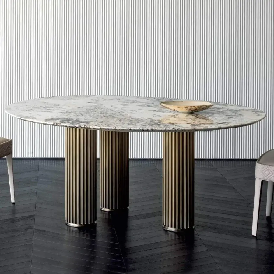 Exceptional Rugiano Liberty table with broadly oval polished marble top and bronze finished aluminum bases