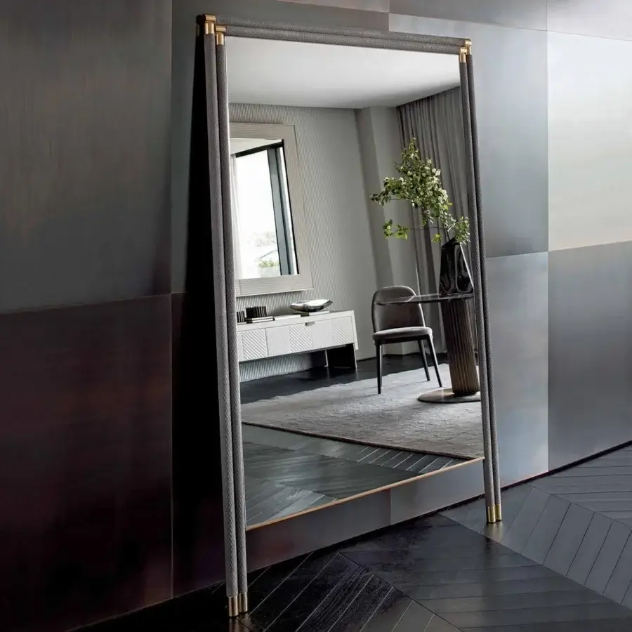 Distinguished Rugiano Boheme mirror with tall rectangular form, dark-toned wood and subtly textured gray textile with golden metal accents