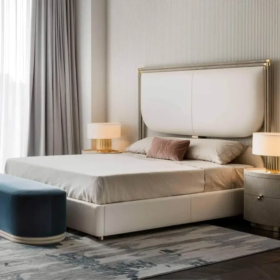 Sophisticated Rugiano Boheme bed with neutral beige upholstery and refined metal detailing offering a matte finish