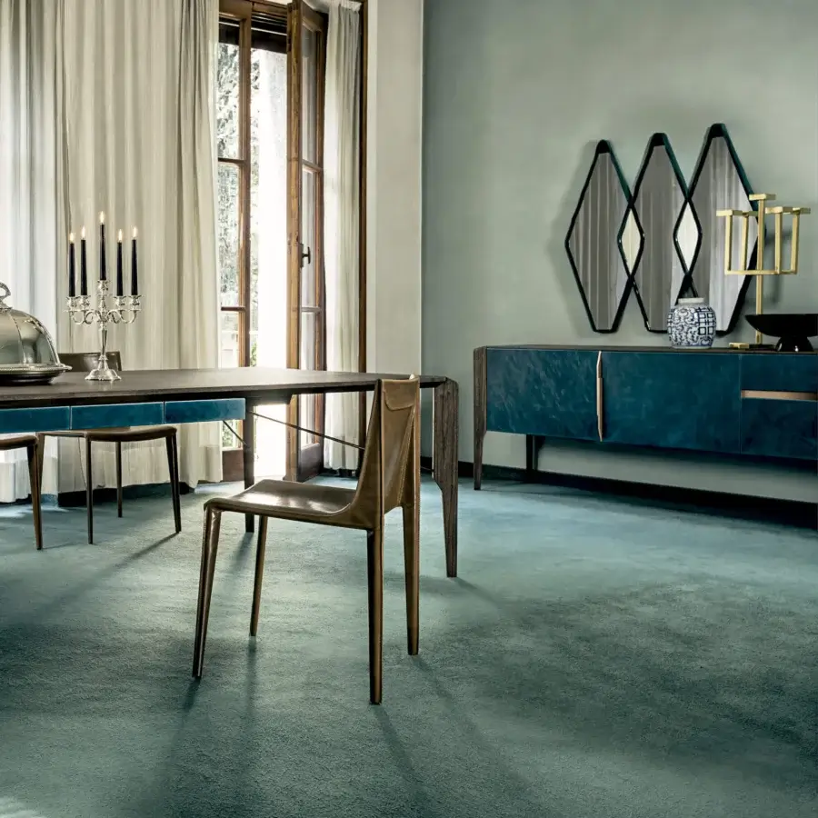 Lavish Arketipo Glory sideboard in teal velvet with gold-colored vertical handles and slim dark metal legs