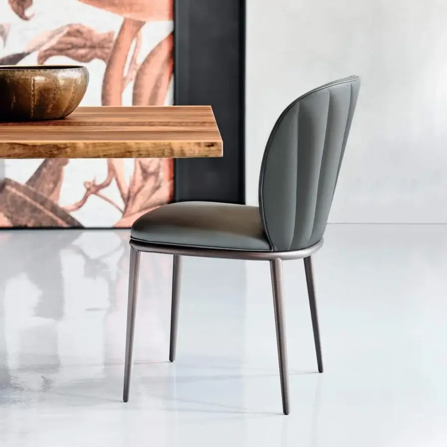 Superior Cattelan Italia Chrishell chair with quilted backrest and bronze embossed lacquered steel base in muted grey-green textile upholstery