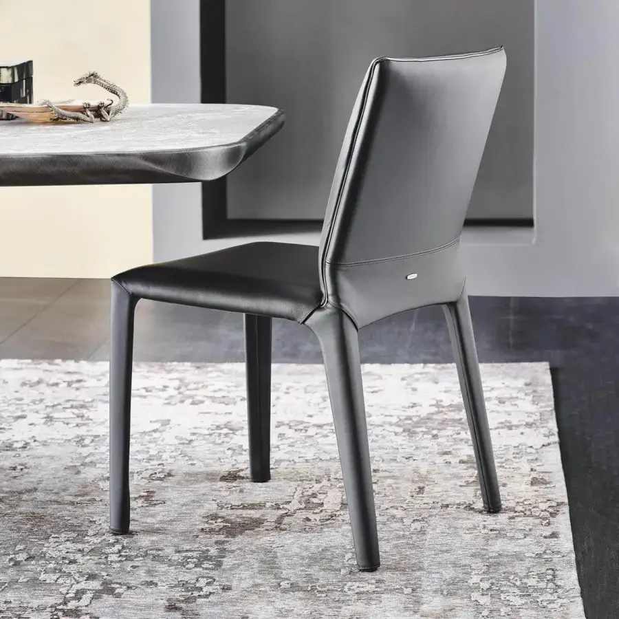 Distinguished Cattelan Italia Penelope chair with dark gray synthetic leather upholstery and gun metal grey piping detail