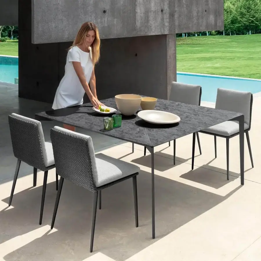Distinguished Talenti Leaf table crafted in Italy with a dark charcoal Vitter composite tabletop and supporting legs