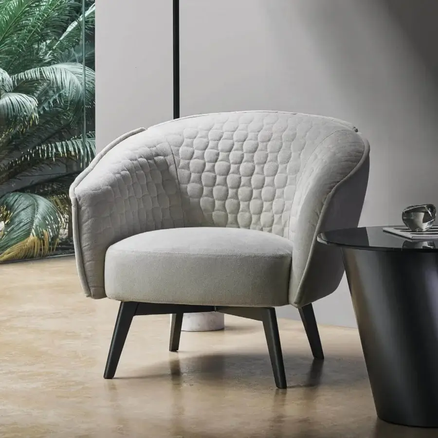 Sophisticated Bonaldo Bruno lounge chair with textured light beige upholstery and satin dark-toned wooden legs