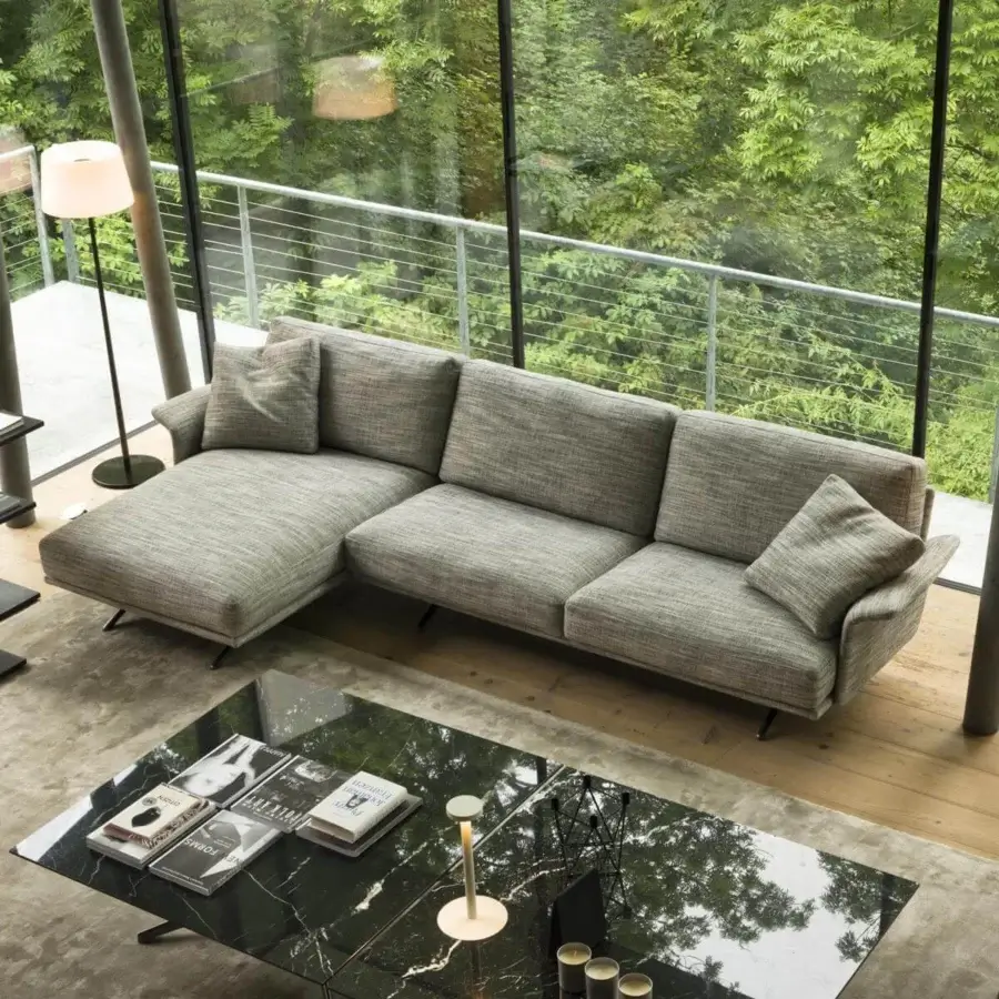 Distinguished Verzelloni Nilson sectional with textured matte gray textile upholstery and squared cushions presenting a minimalist aesthetic