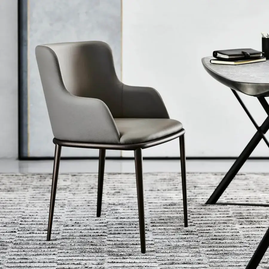 Superior Cattelan Italia Magda ML chair with enveloping silhouette in muted gray synthetic material and dark matte metal legs