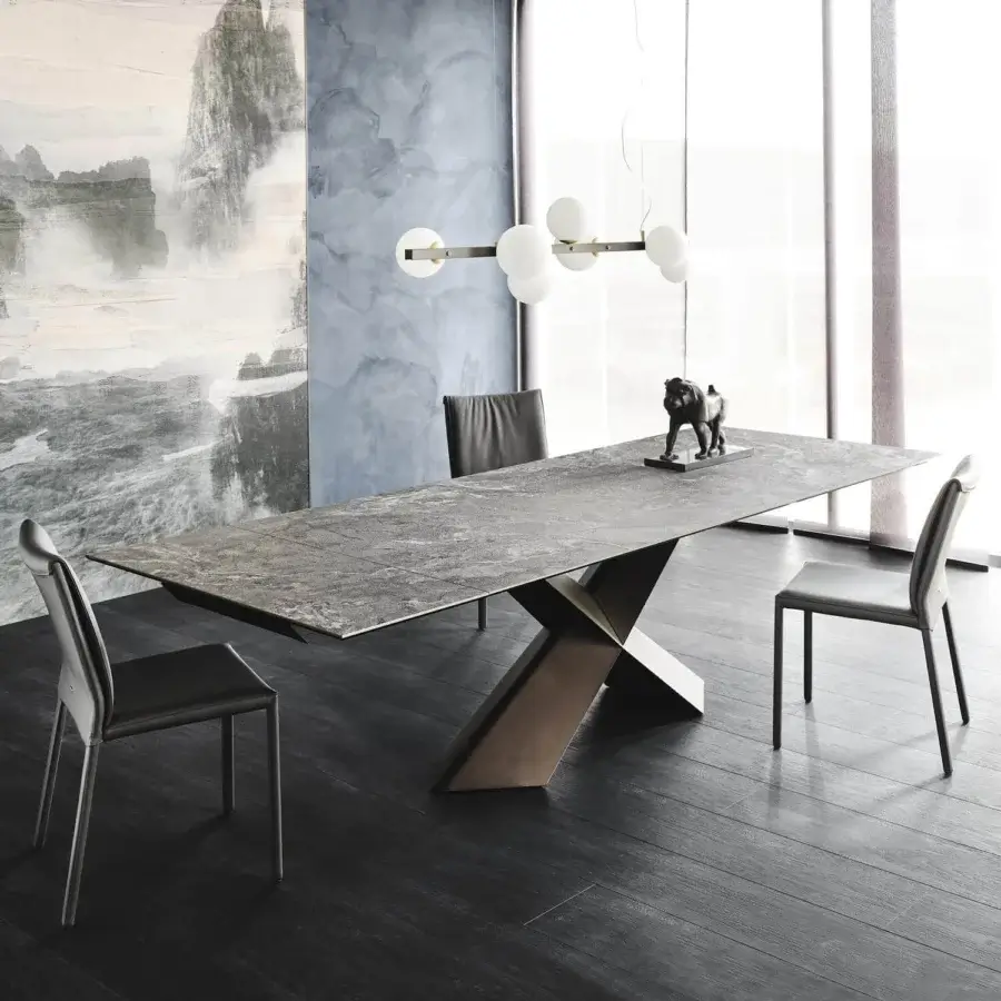 Elegant Cattelan Italia Tyron table with geometric bronze embossed lacquered steel base and Ardesia marmi ceramic top
