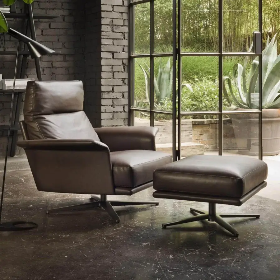 Exclusive Verzelloni Nilson lounge chair with generous lines upholstered in timeless brown leather and swiveling aluminum base