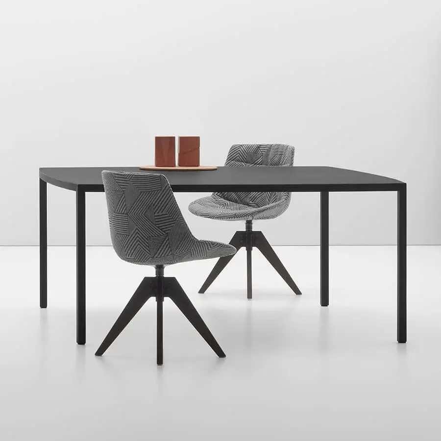 Refined MDF Italia Tense Curve table with composite board top and steel legs in matte black finish