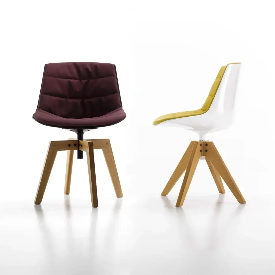 Sophisticated MDF Italia Flow chair with inviting maroon quilted textile upholstery and natural light wood tripod base