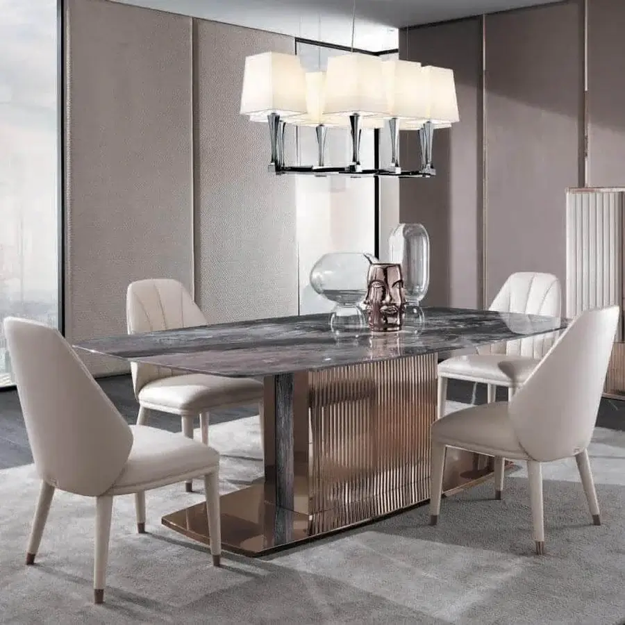 Sophisticated DV Home Collection Windsor table with dark grey and brown marble top and reflective rose-gold stainless steel base