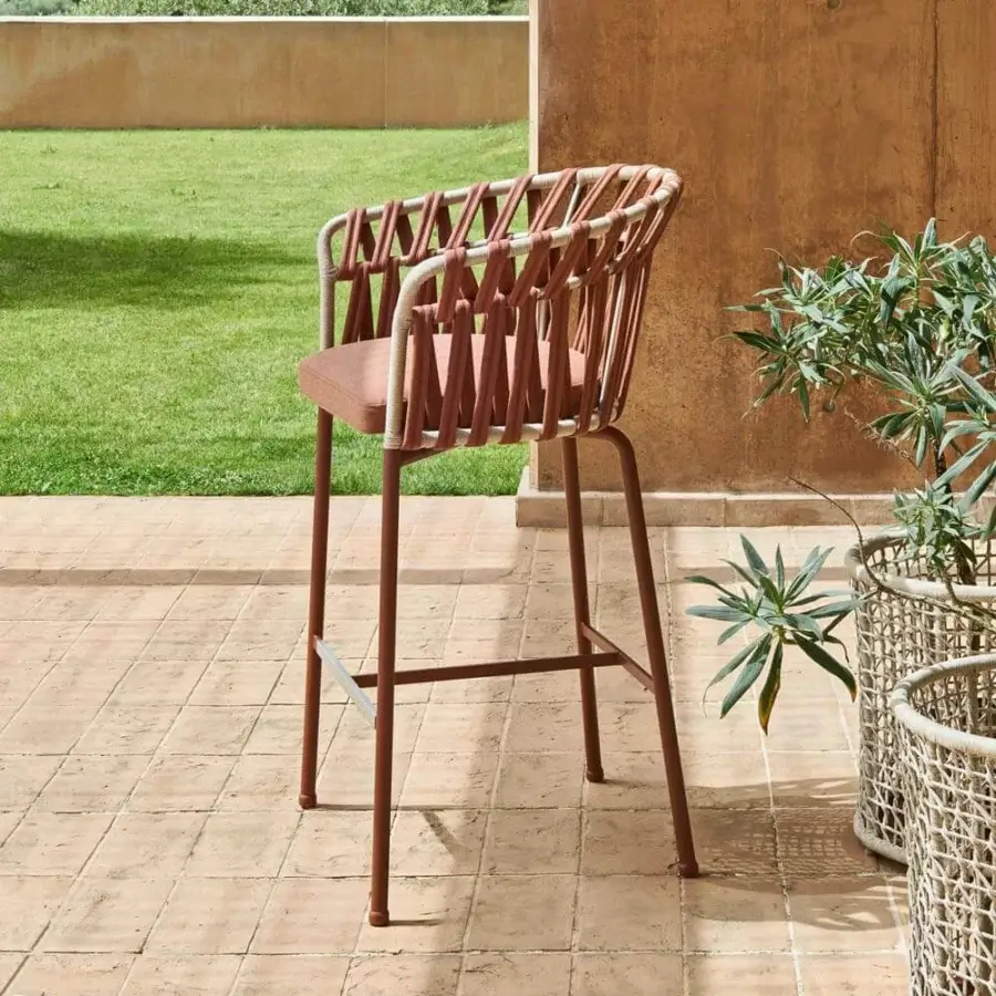 Superior Varaschin Emma Cross stool with cream synthetic fiber rope and a subdued red padded seat in brownish-red powder-coated aluminum