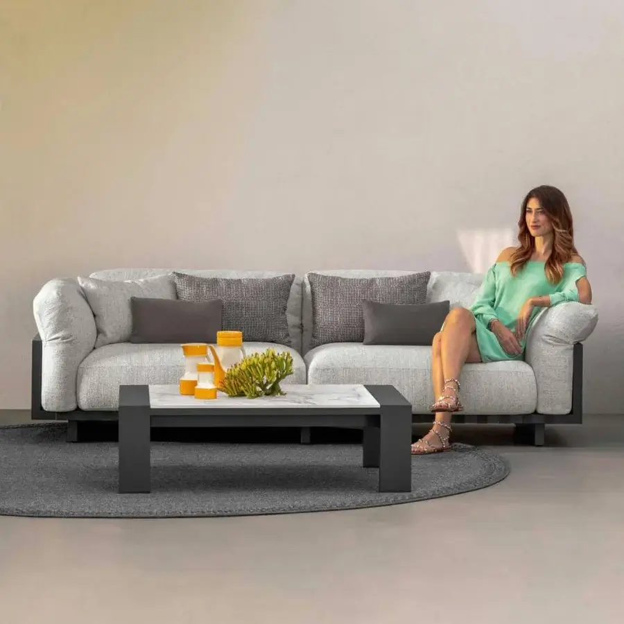 Sophisticated Talenti Argo Alu sofa with graphite aluminum frame and light gray weather-resistant cushions featuring woven elastic straps